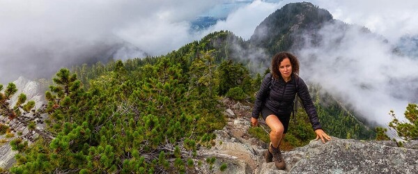 Woman climbing Mountain